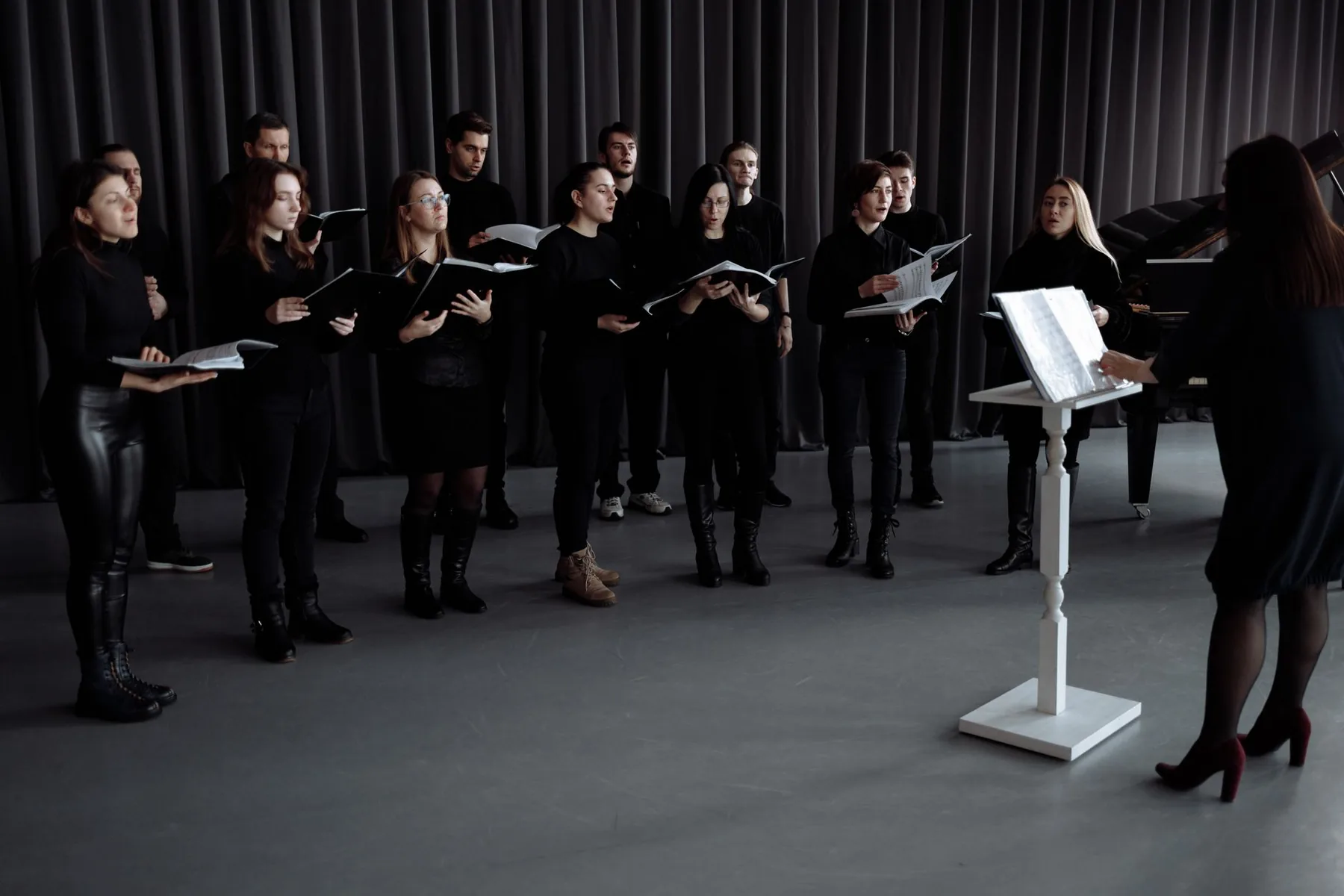 Choir singing with scores Choir singing with scores