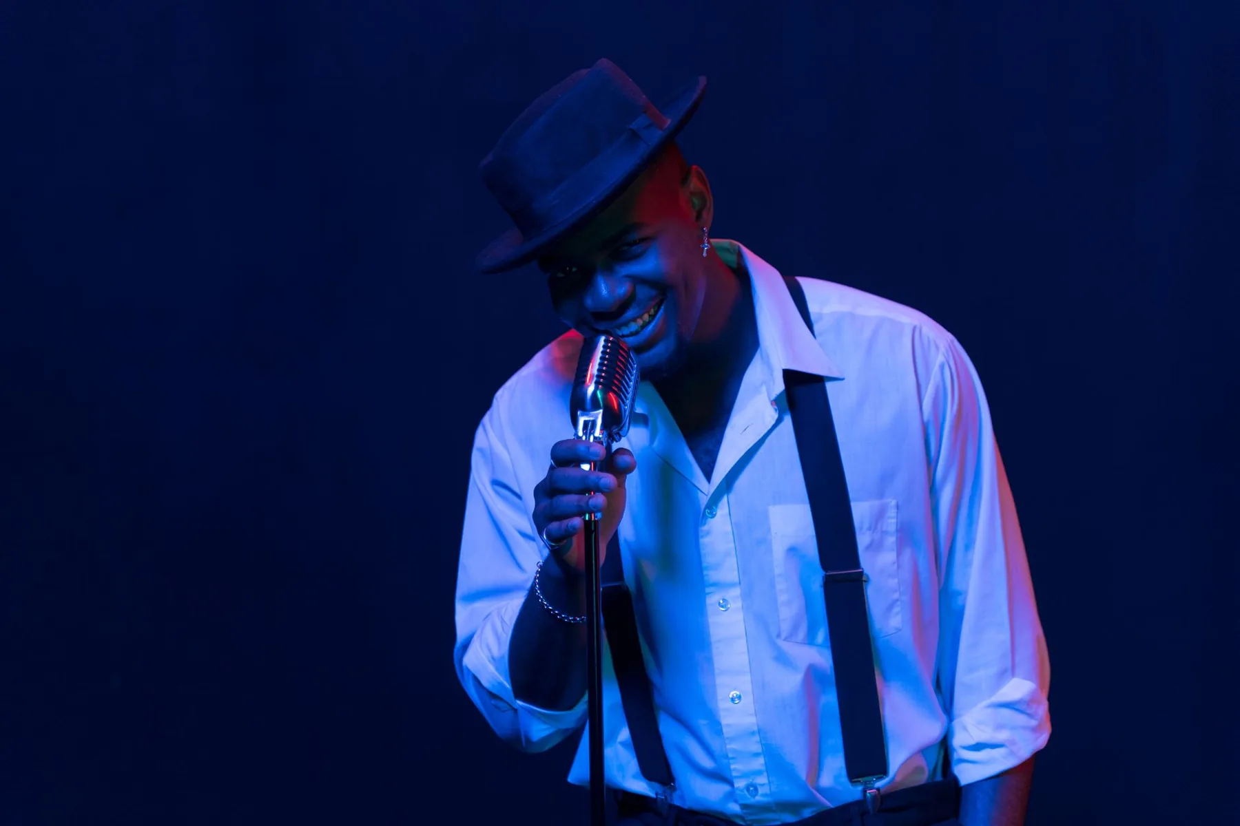 singer at the microphone in vocal warm-up