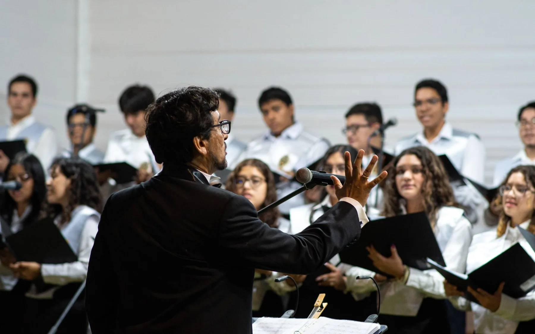 Choir conductor leading singers Choir conductor leading singers