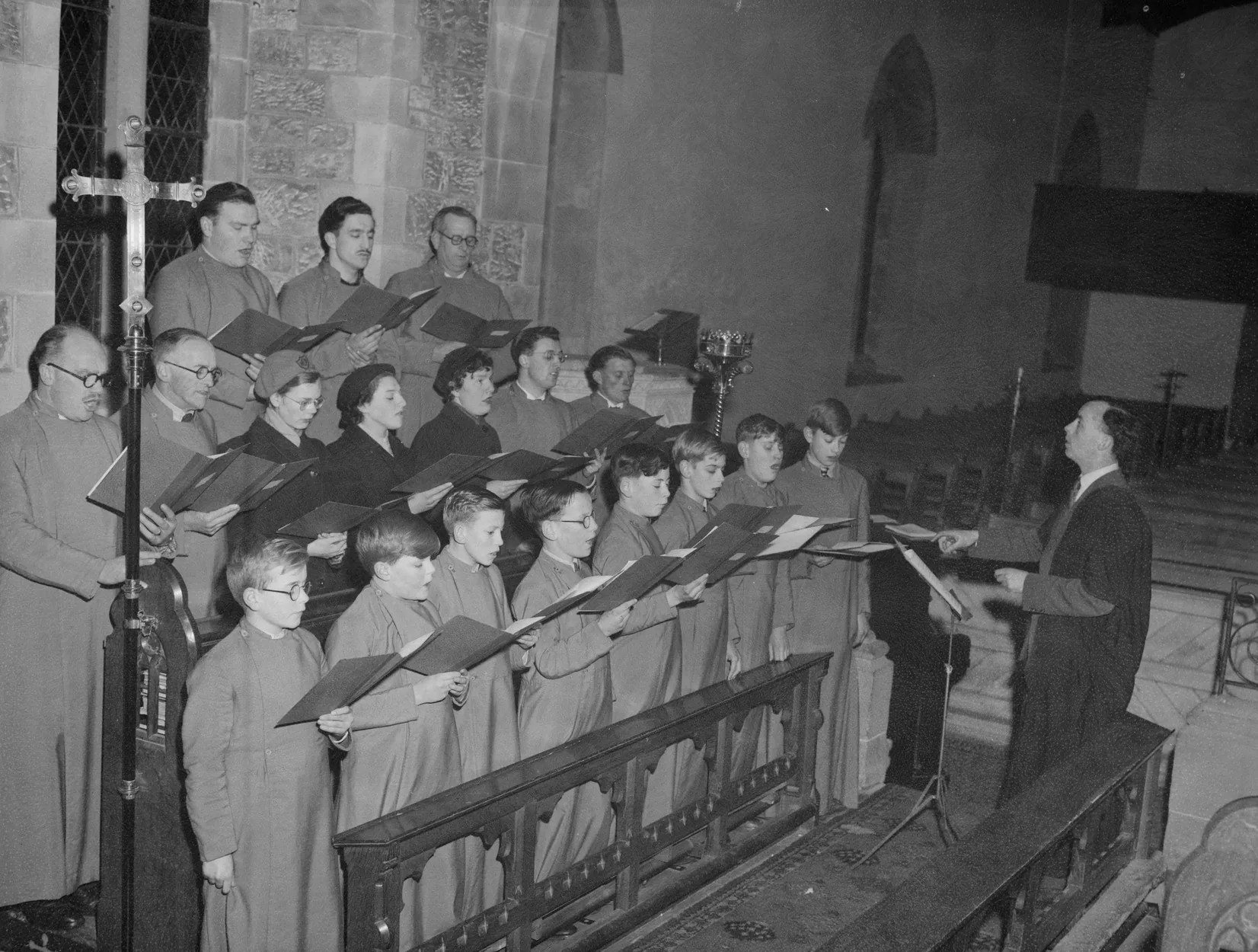 Adult choir conducted in a church Adult choir conducted in a church