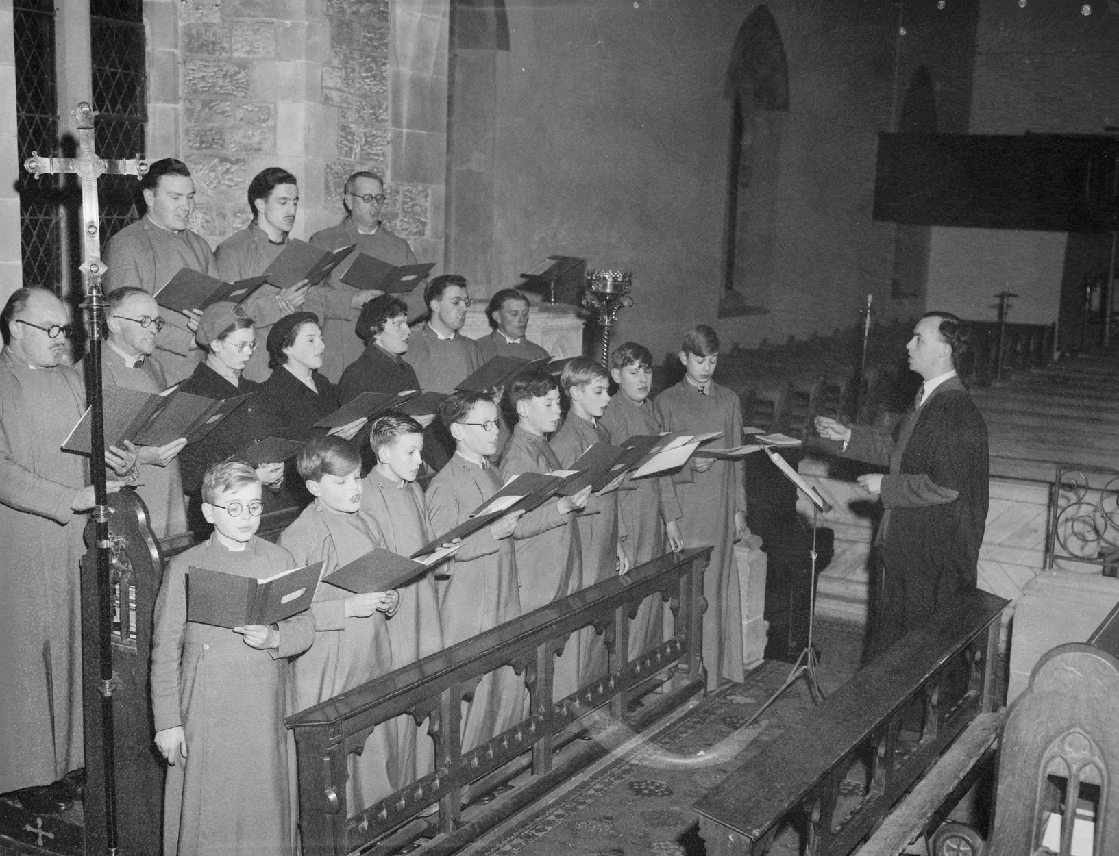 Choir director leading a church choir Choir director leading a church choir