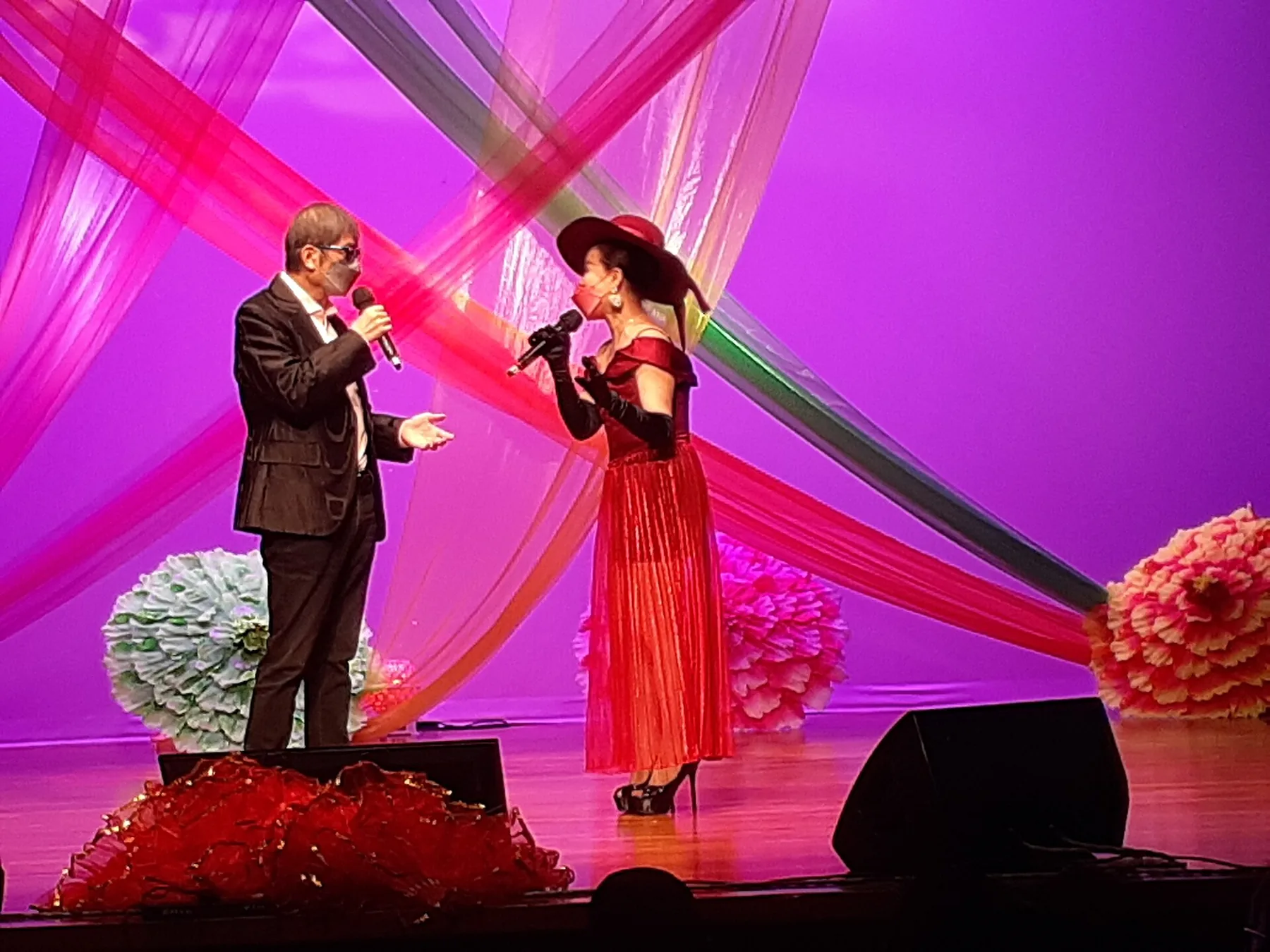 Vocal duo on a colorful stage Vocal duo on a colorful stage