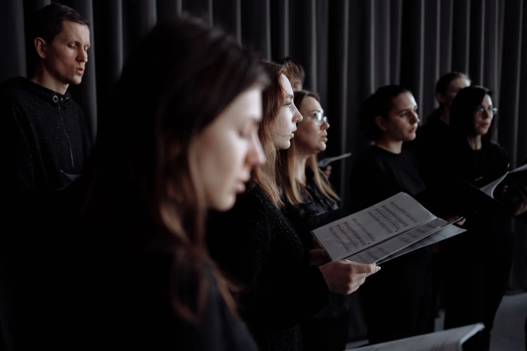choir singers with scores