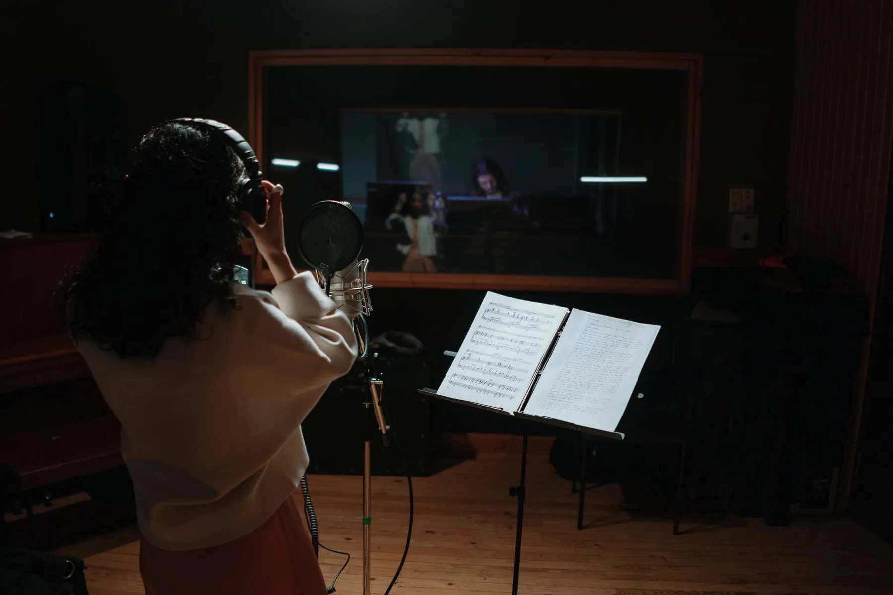 Sheet music for a singer in a studio Sheet music for a singer in a studio
