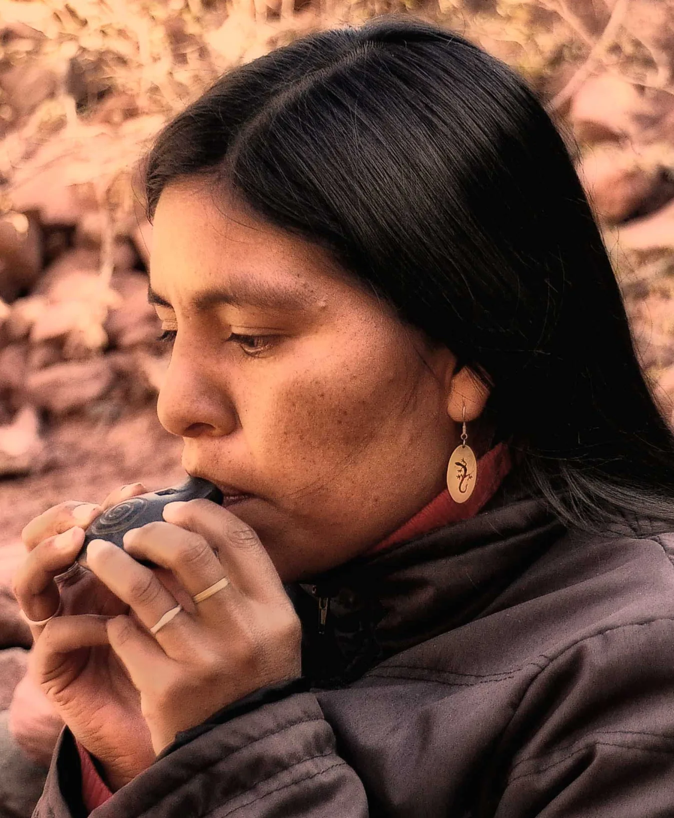 Female ocarina player in close-up
