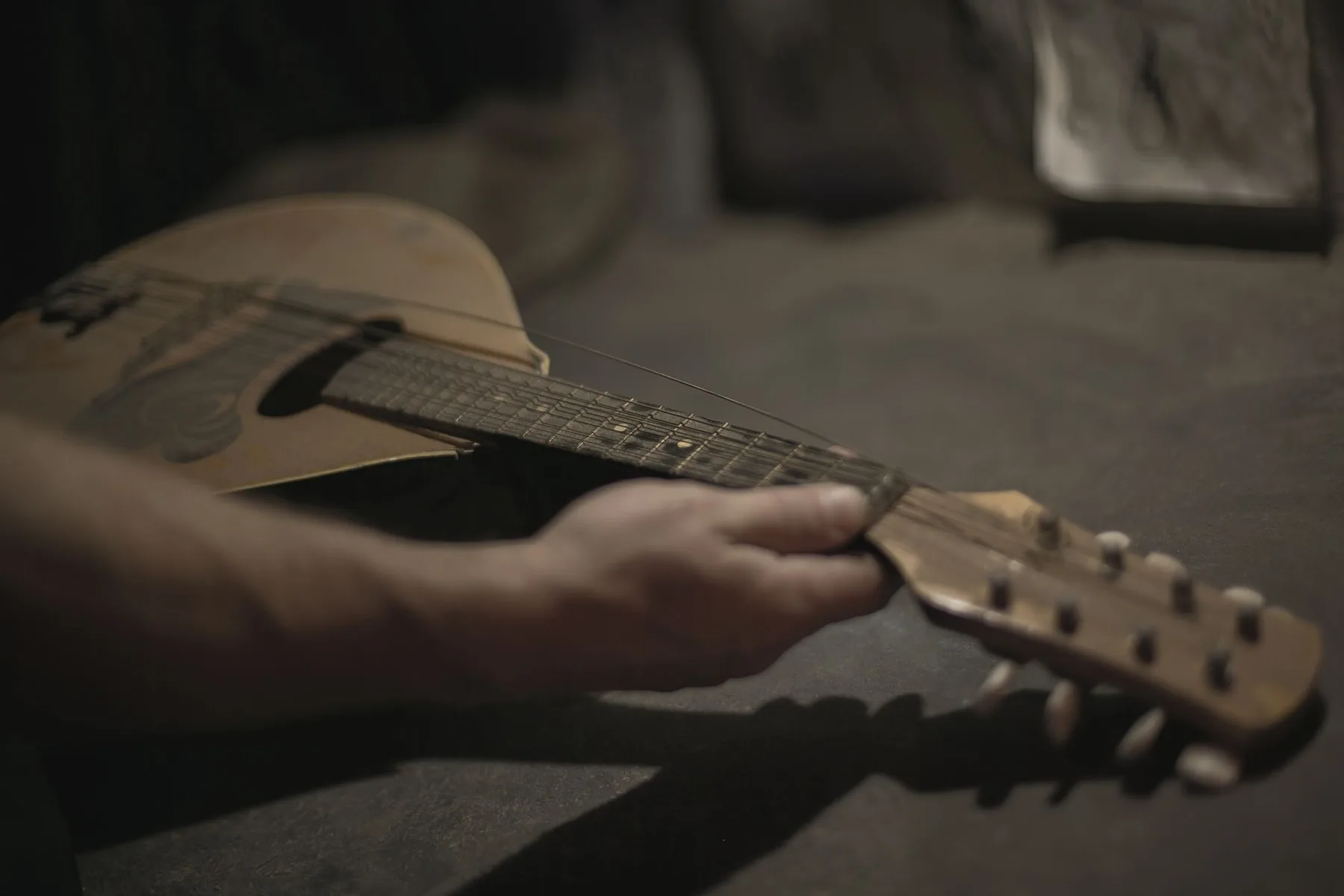 Musician holding an acoustic guitar